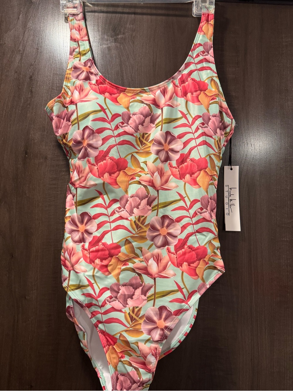 Brand new Nicole Miller ladies swimsuit; size medium ;new with tags never worn